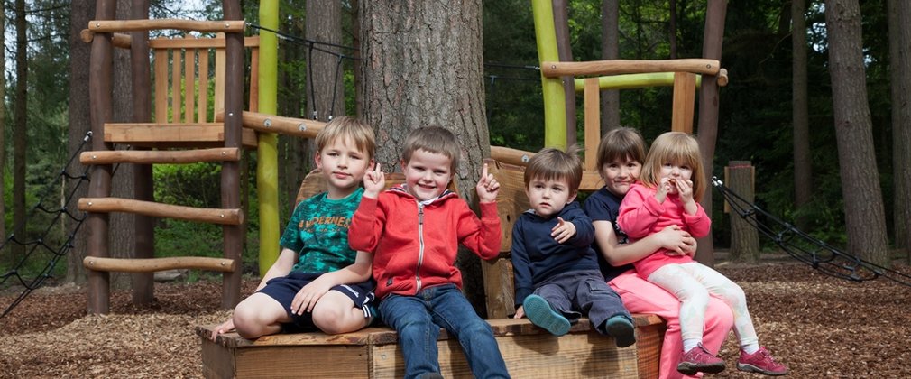 Children playing in the Timberline play area at Alice Holt Forest
