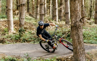 male mountain biker in woodland