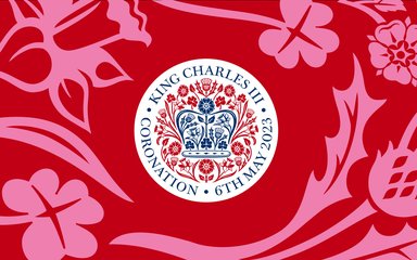 The official emblem of the coronation of King Charles III shown on a red background with pink flowers.
