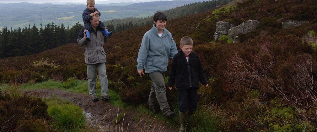 Family walking at Simonside, near Rothbury