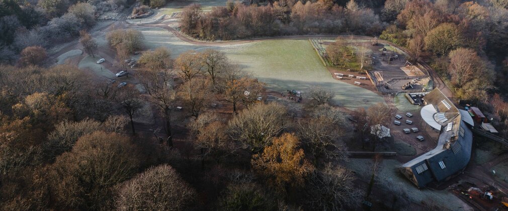A bird's eye view of Beechenhurst Cafe and the wider forest covered in frost.