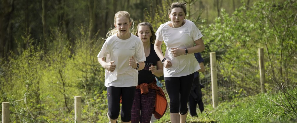 Kids running in the woods 