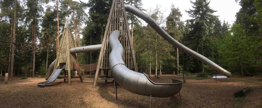 Large slide and childrens play area in the woods