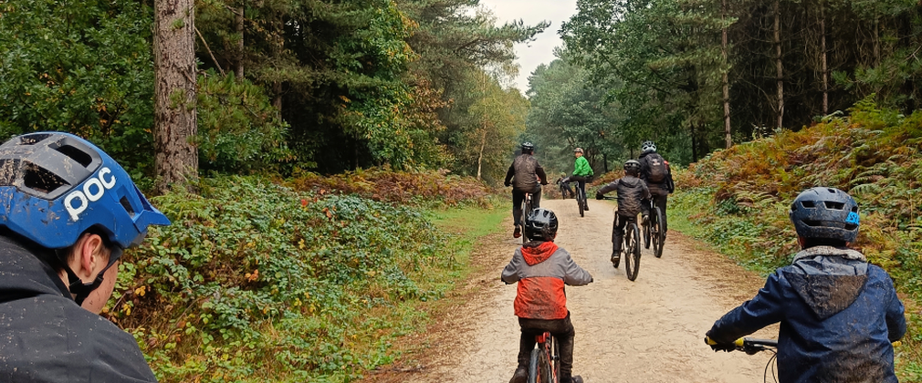 Children riding bikes on a trail