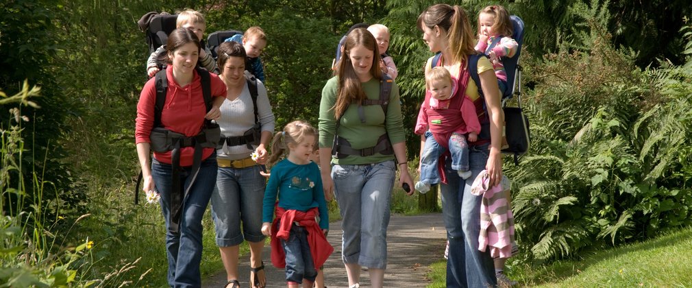 Families enjoying a walk in the forest