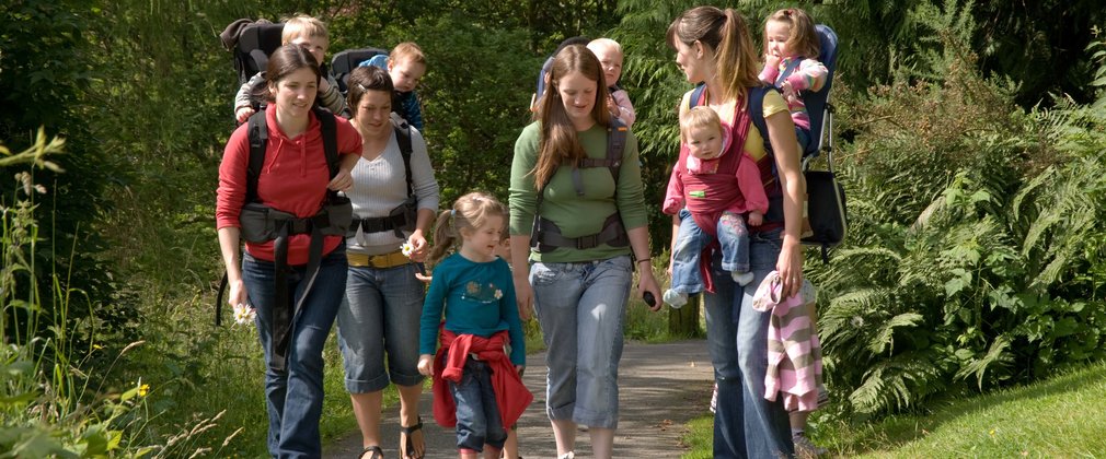 Families enjoying a walk in the forest