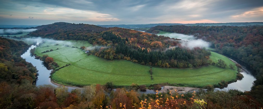 Sunrise over Symonds Yat with mist in the valley 