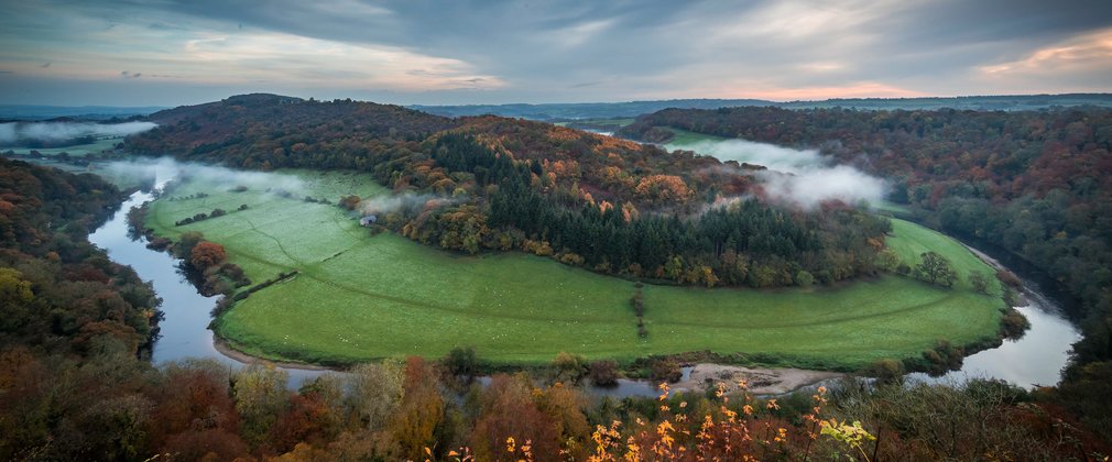 Sunrise over Symonds Yat with mist in the valley