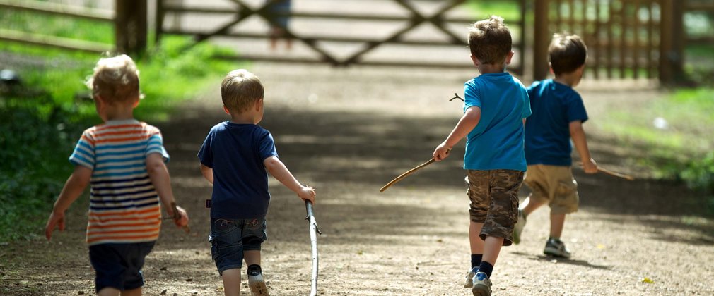 Children running and enjoying the forest 