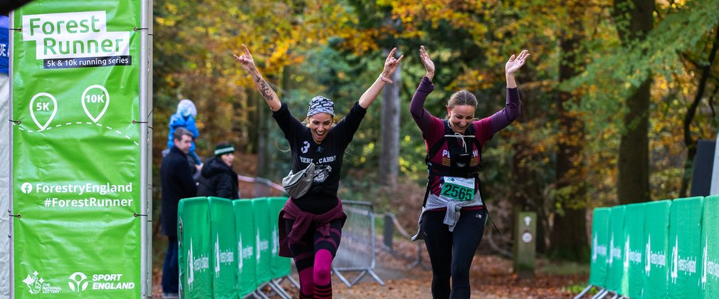 2 happy women ending a running race