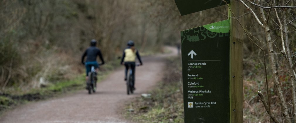 Riders on family cycling trail in the Forest of Dean