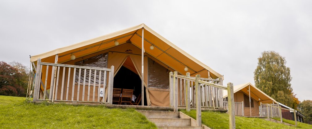 Safari tent exterior with steps leading up to entrance