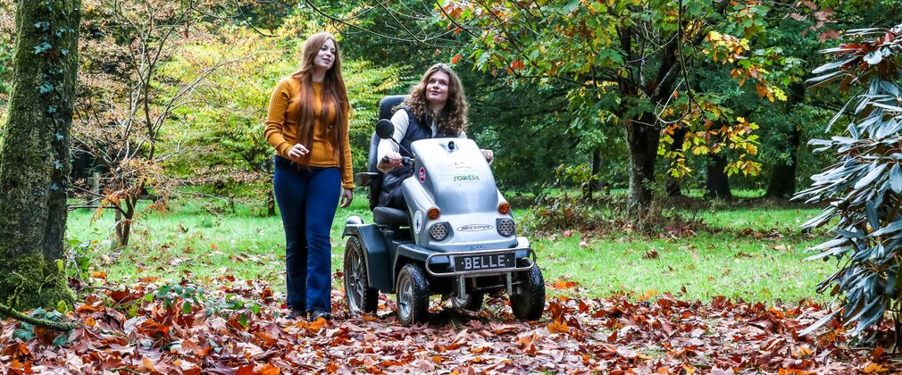A family enjoying Autumn colours at Cryil Hart Arborteum including Tramper mobility scooter use