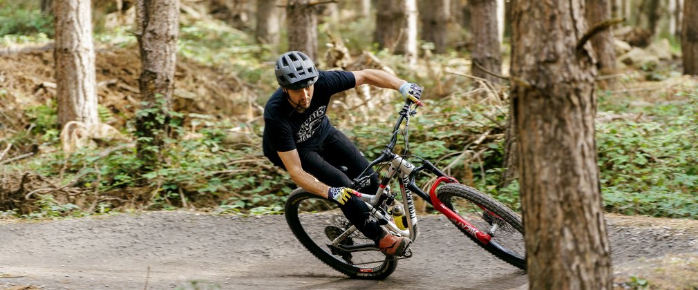 male mountain biker in woodland