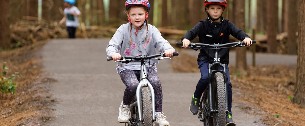 Two young people cycling