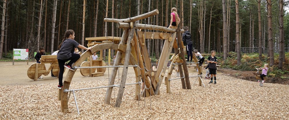 Children on a bike shaped climbing frame