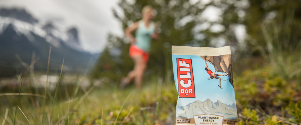 Clif Bars product with runner in a forest