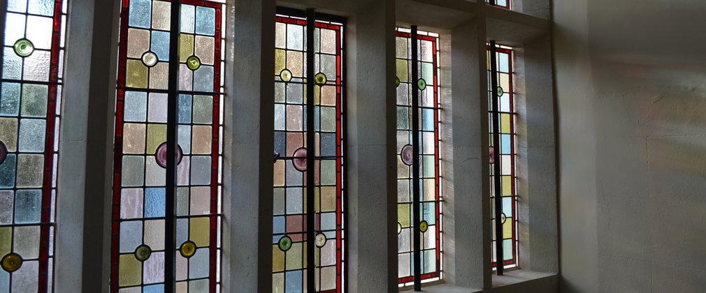 Close up of a stain glass window inside Verderes Hall 