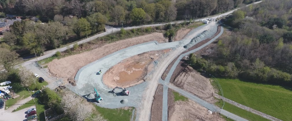 Aerial view of coach car park within the forest