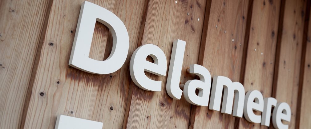 Lettering on the side of a wooden building, saying Delamere Forest