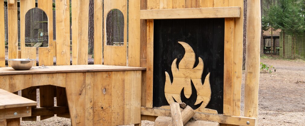 Wooden fireplace in play area