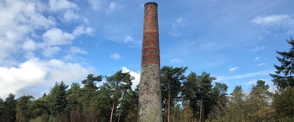 Chimney reflected in pond