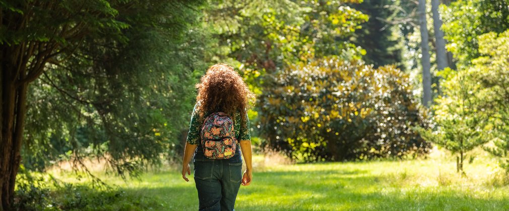 Person walking through field