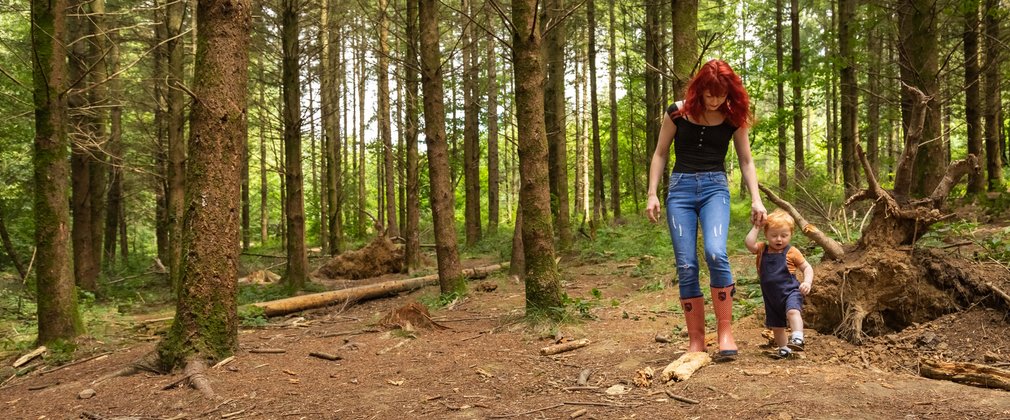 Young family walking and den building