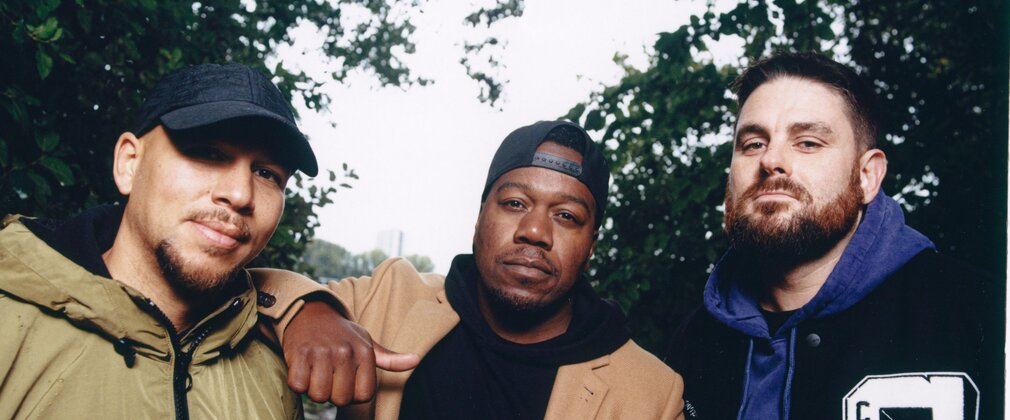 Image of the band Rudimental outdoors in a forest