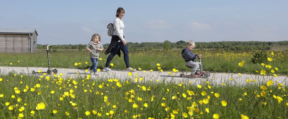 Mum and young children walking at Hicks Lodge