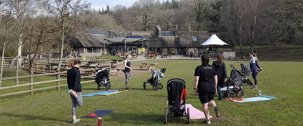 Group of mums exercising with buggies