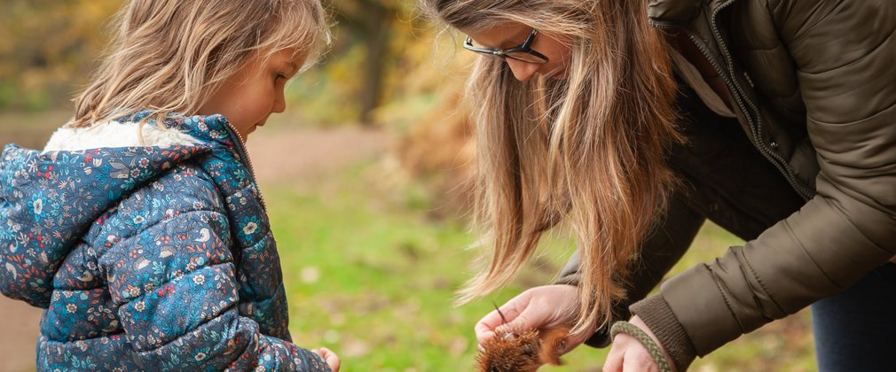 Young girl learning with parent 