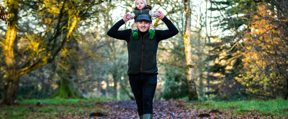 Man and child in forest