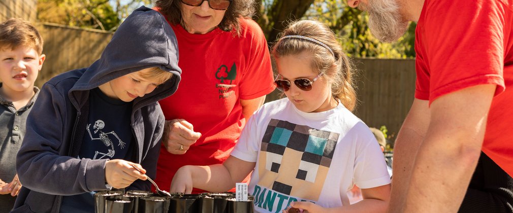 Bedgebury Pinetum nursery team planting with children
