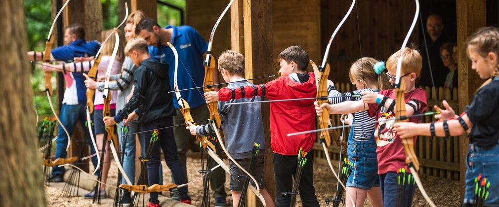 children shooting at archery