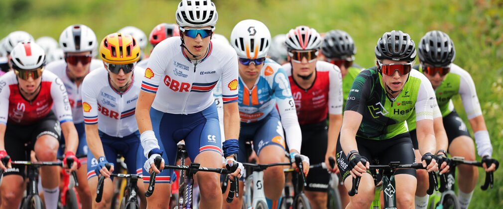 A peloton of female cyclists taking part in a race