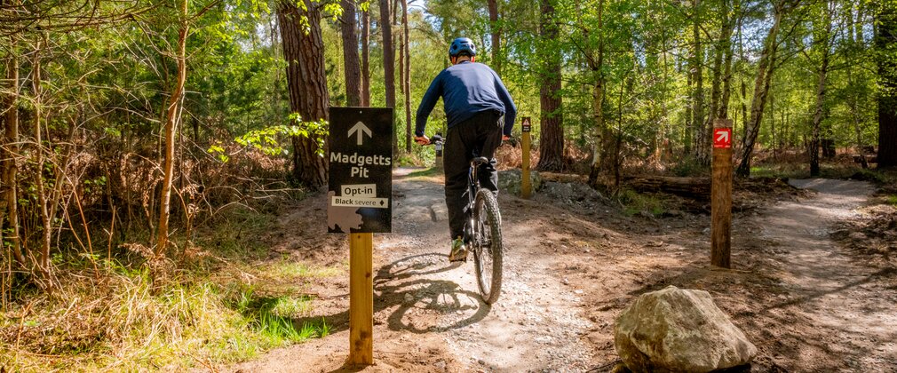 Cyclists rides towards madgetts pit