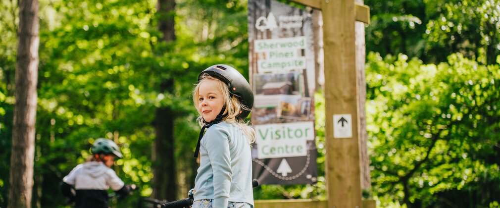 Kid on bike in forest