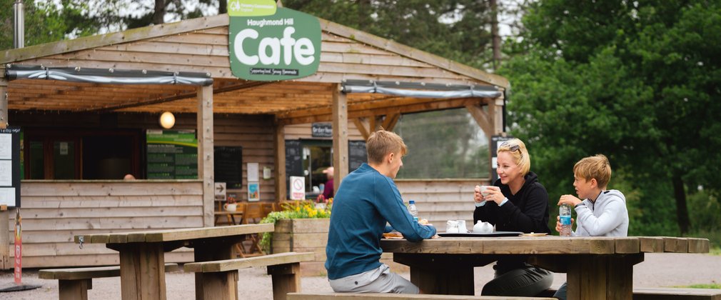 A family eating lunch outside a cafe