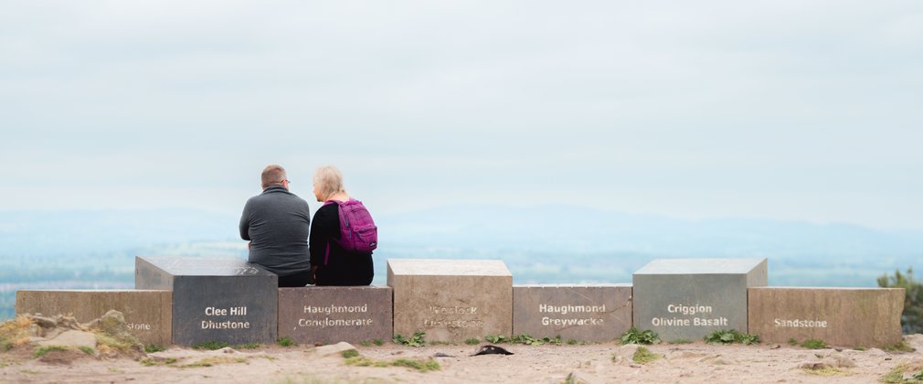 A couple enjoying the view at the top of Haughmond Hill