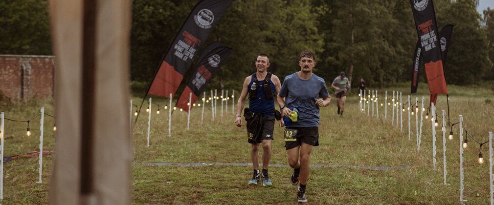 3 runners about to cross the finish line. 