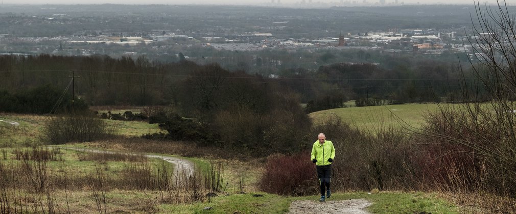 man walking in woodlands
