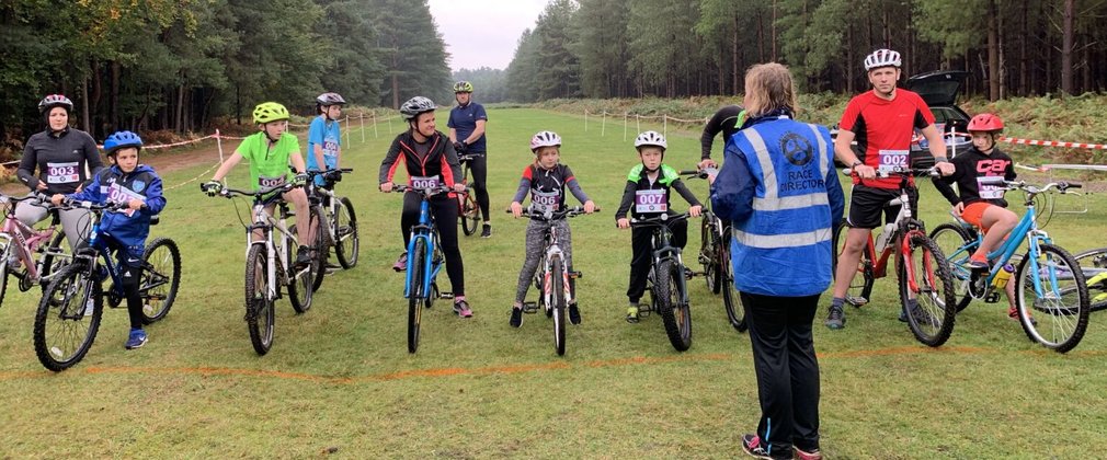 People on bikes ready at start line