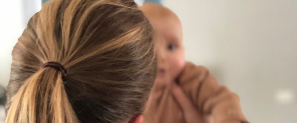 baby and mother at postnatal yoga