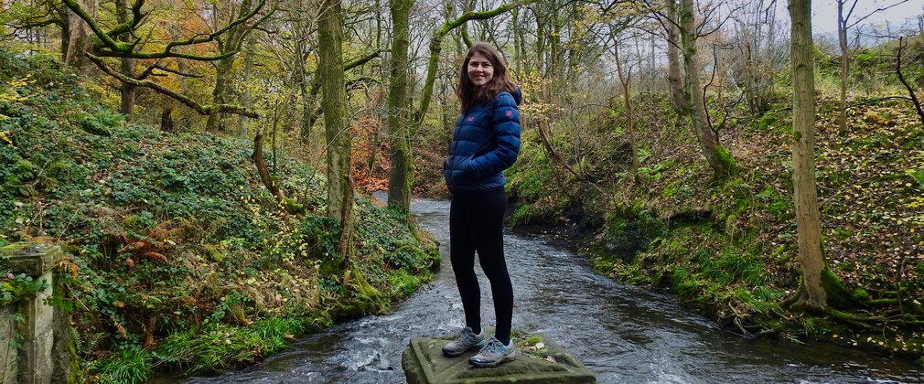 Tiffany Francis-Baker stood next to stream in the forest