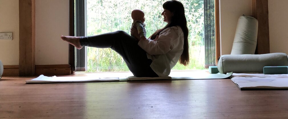 Yoga pose with a baby