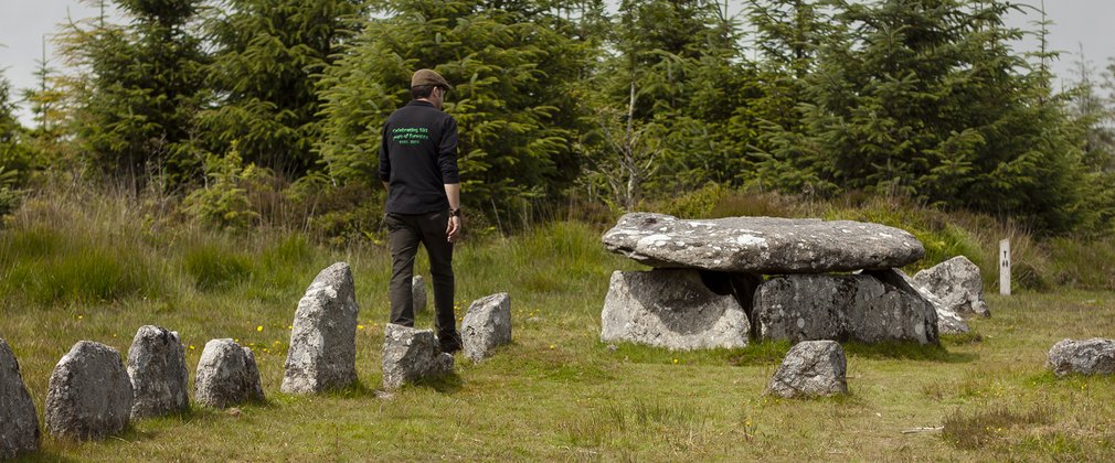 A ranger walking through historic site at Bellever