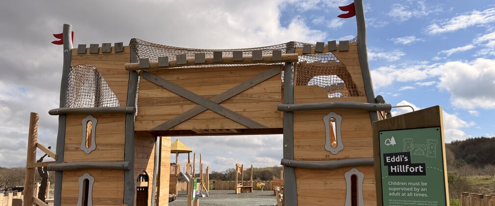 A wooden castle-shaped structure that is part of Eddi's Hillfort play area