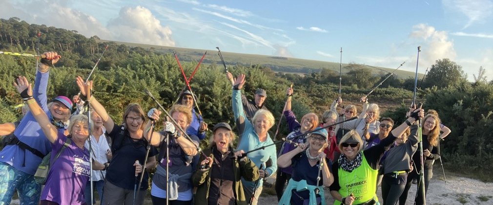 Group os nordic walkers on top of a hill
