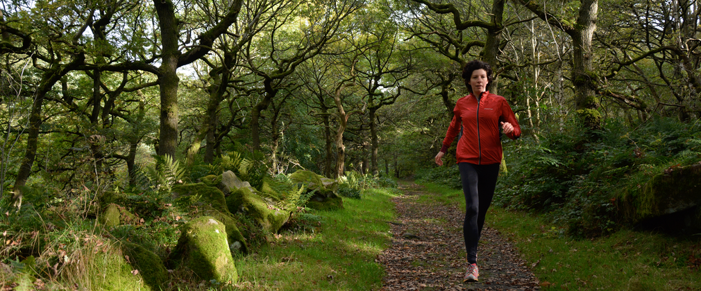 Woman running in the woods